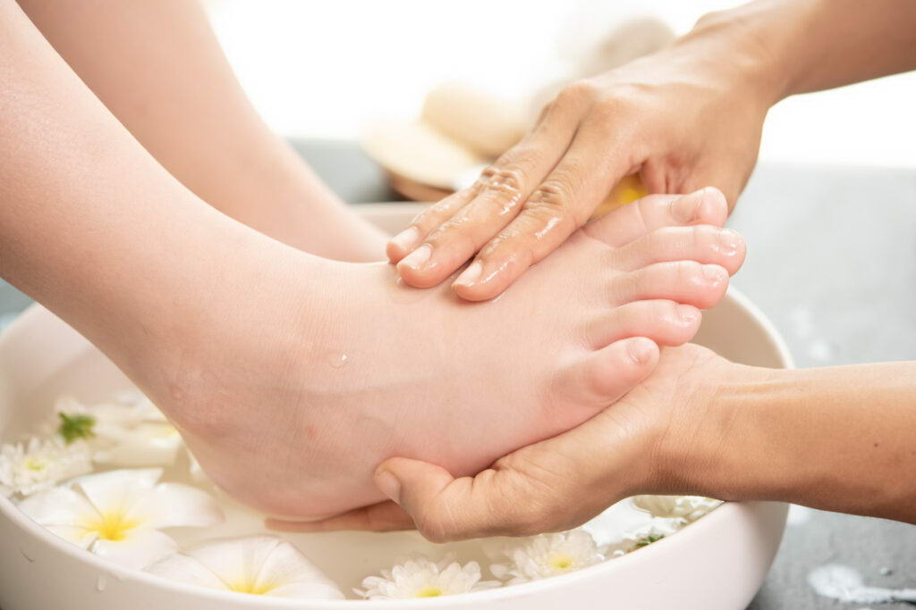 foot washing in spa before treatment. spa treatment and product